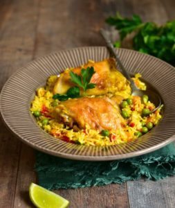 chicken recipe image, Pollo Arvejado over a bed of saffron rice