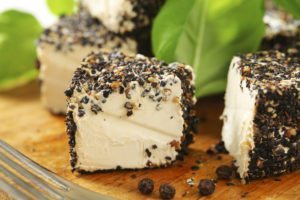 Fresh cheese rolled in black pepper